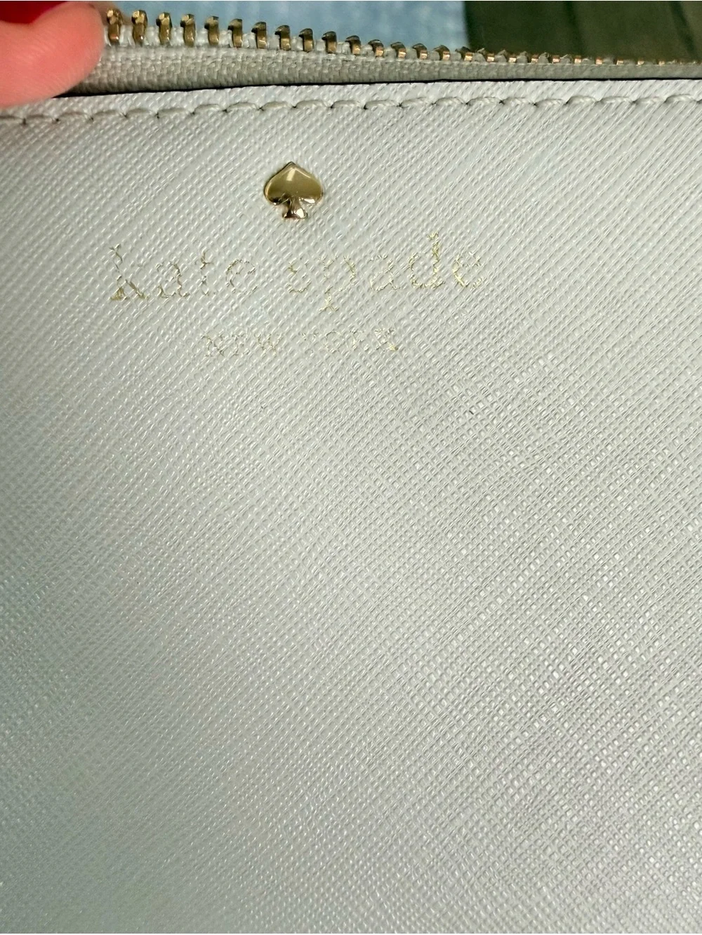 Kate Spade gray zip-around saffiano leather wallet with gold logo